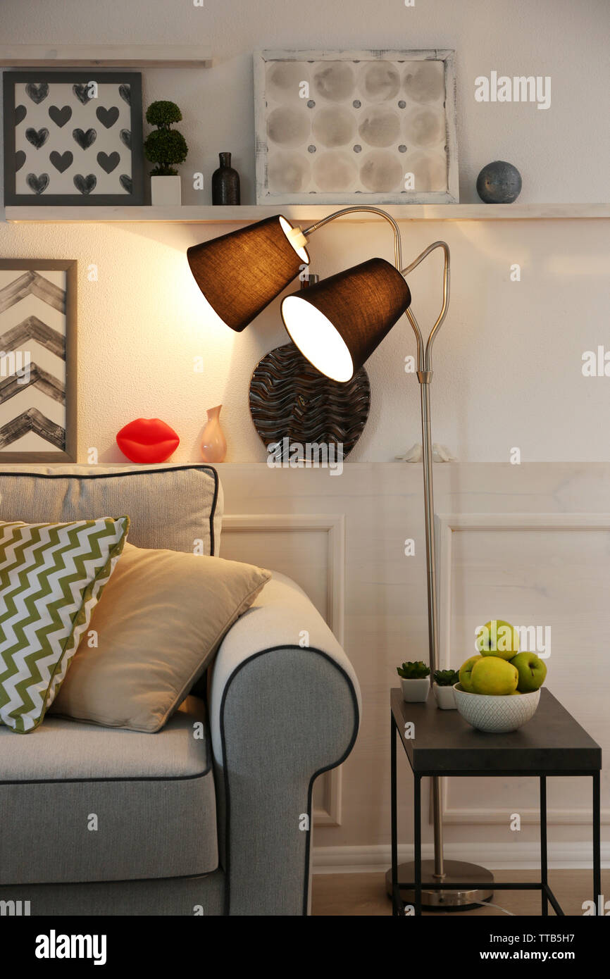 Beautiful modern living room with grey sofa and floor lamp Stock Photo ...