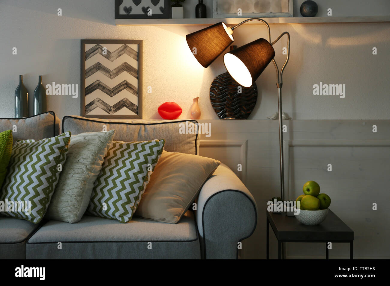 Beautiful modern living room with grey sofa and floor lamp Stock Photo ...