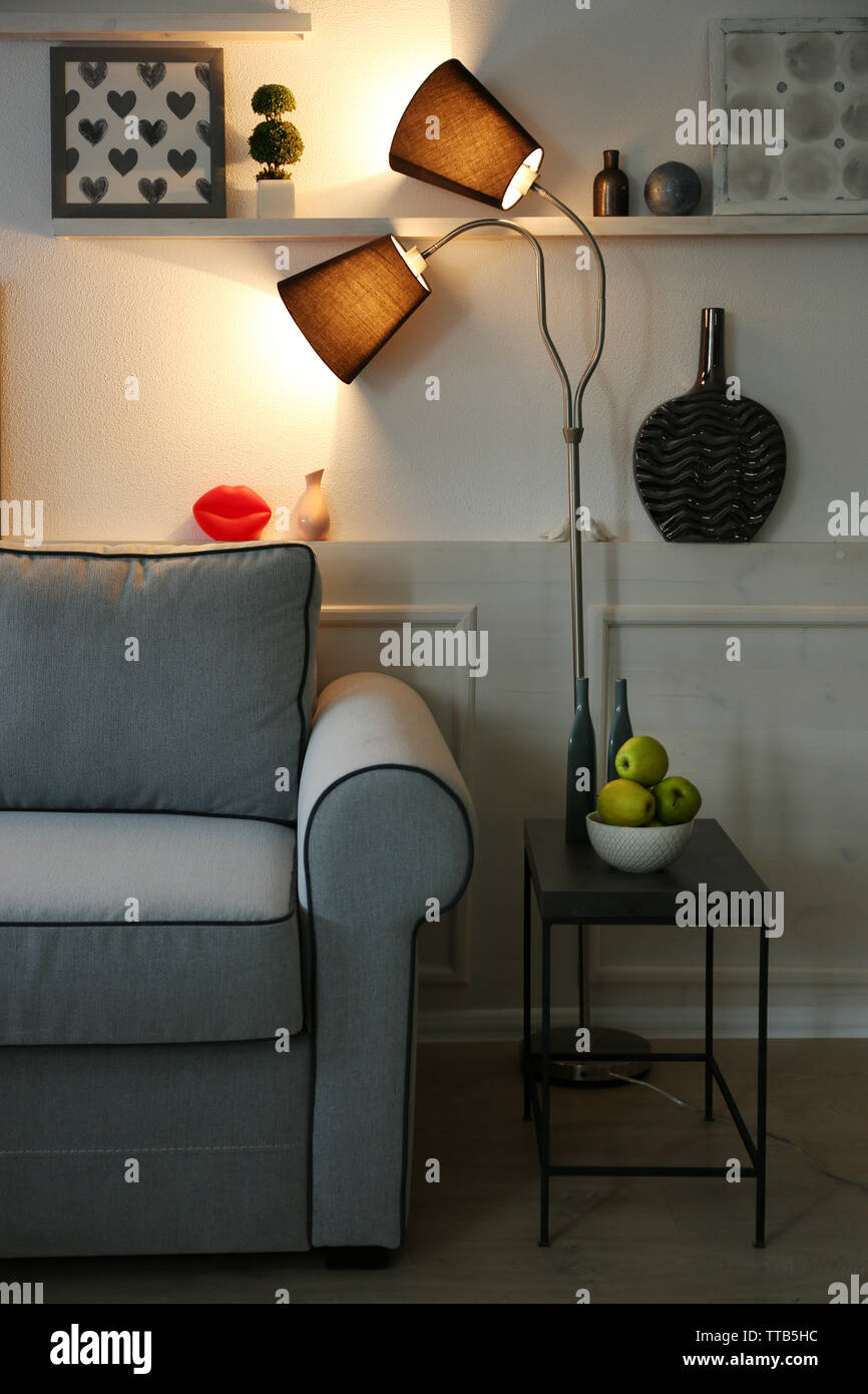 Beautiful modern living room with grey sofa and floor lamp Stock Photo ...