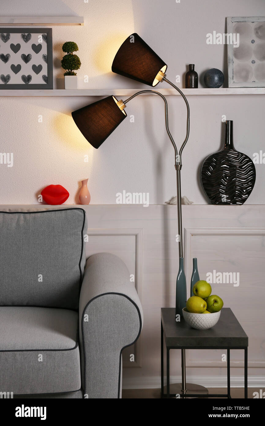 Beautiful modern living room with grey sofa and floor lamp Stock Photo