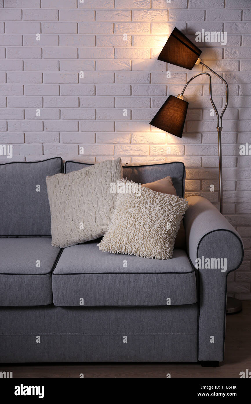 Beautiful modern living room with grey sofa and floor lamp Stock Photo ...