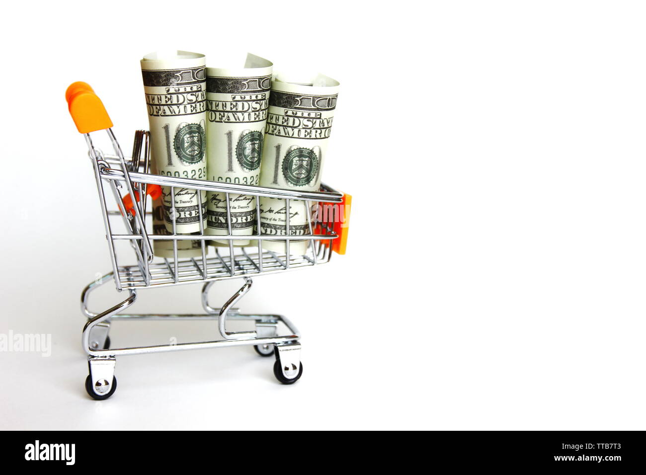 American bank note in roll pattern on small trolley. American money circulated world wild. money for payment,saving, legal repayment. Stock Photo