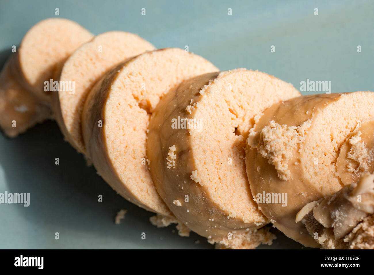 Cod roe that has been boiled, allowed to cool and then sliced before frying. The cod, Gadus morhua, was caught in the north eastern Atlantic and bough Stock Photo