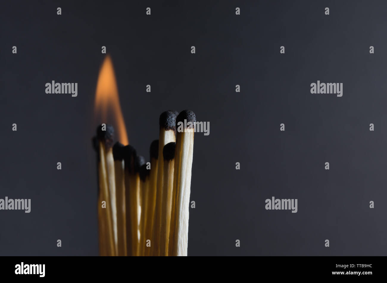 Burning matches with orange flames on a black background Stock Photo ...