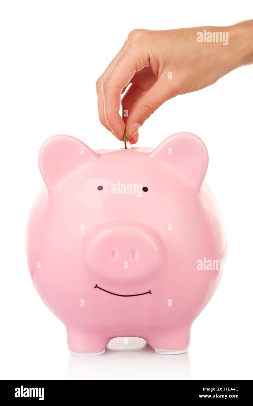 Female hand putting coin into piggy bank isolated on white Stock Photo ...
