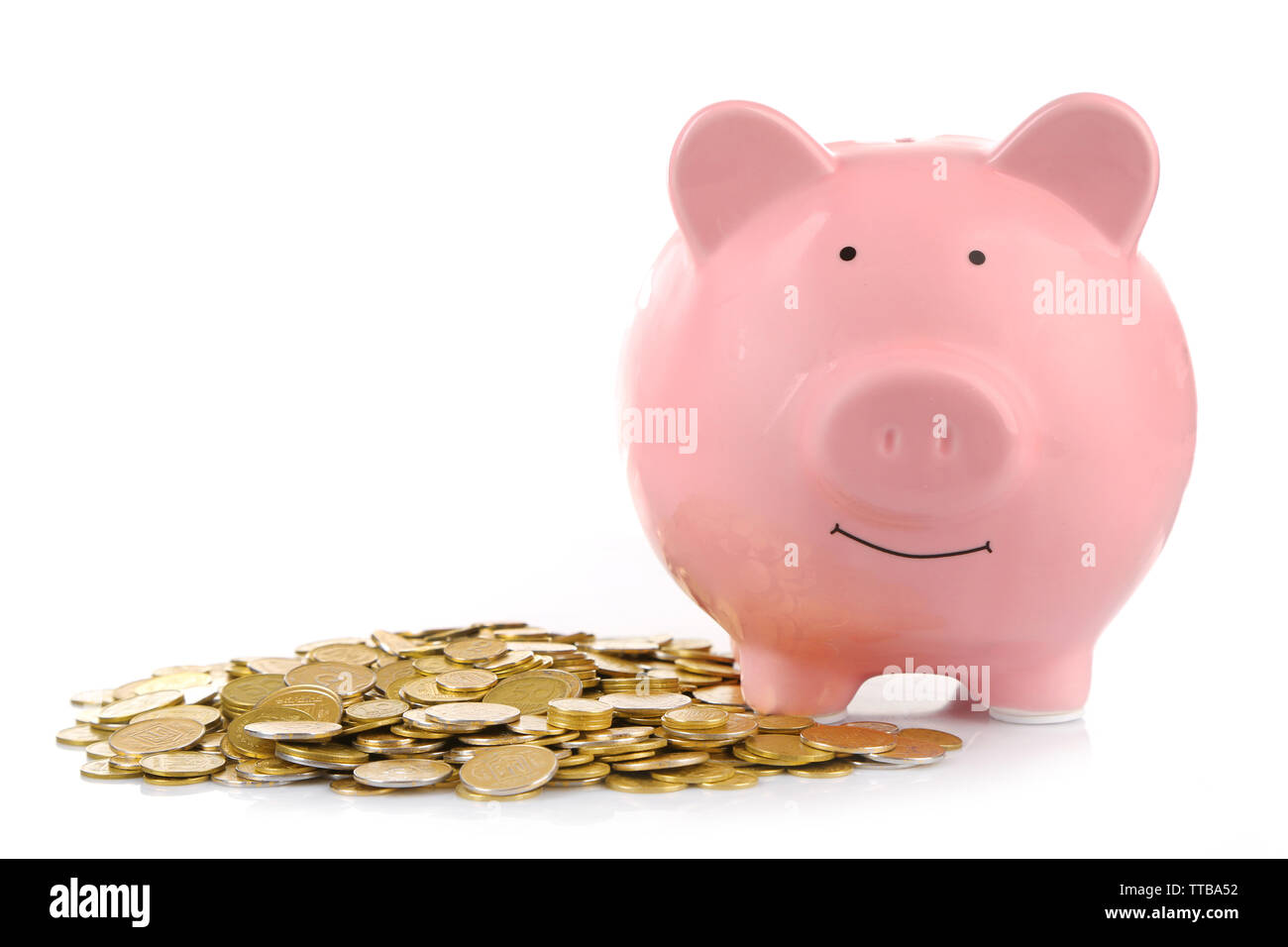 Pink piggy bank with coins isolated on white Stock Photo - Alamy