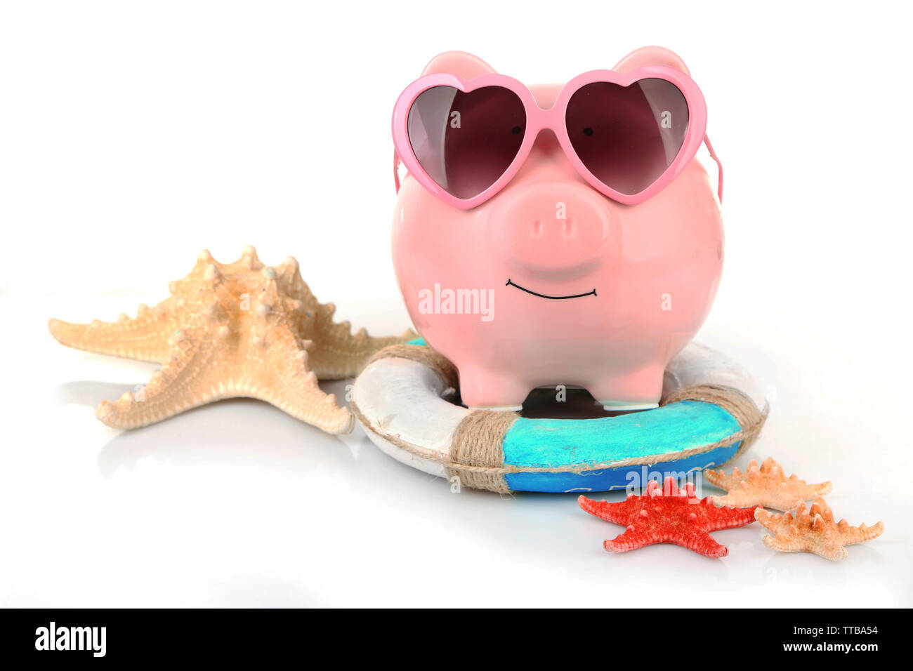 Pink piggy bank in sunglasses with starfishes and lifebuoy isolated on ...