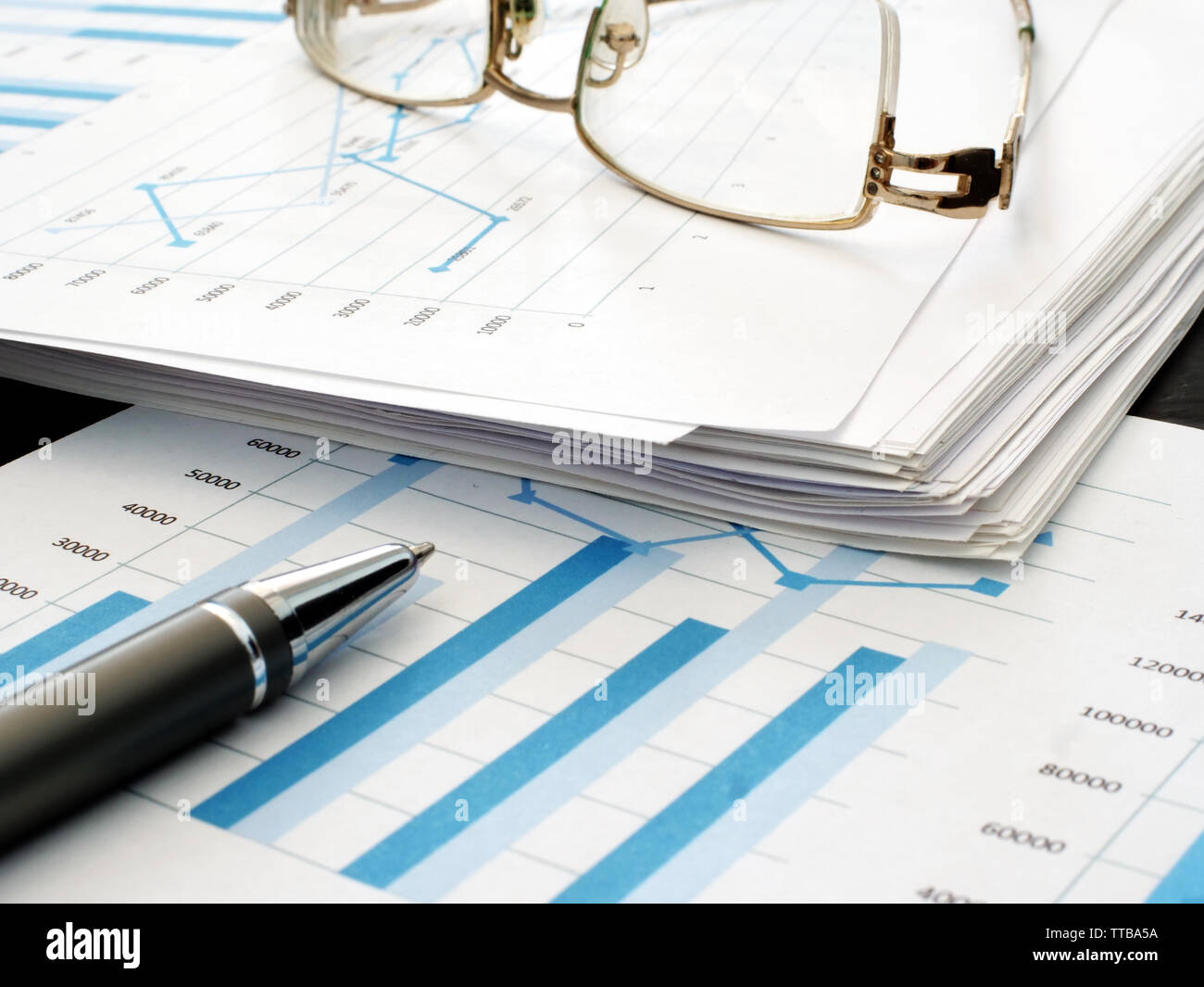 Stack papers financial report charts hi-res stock photography and ...