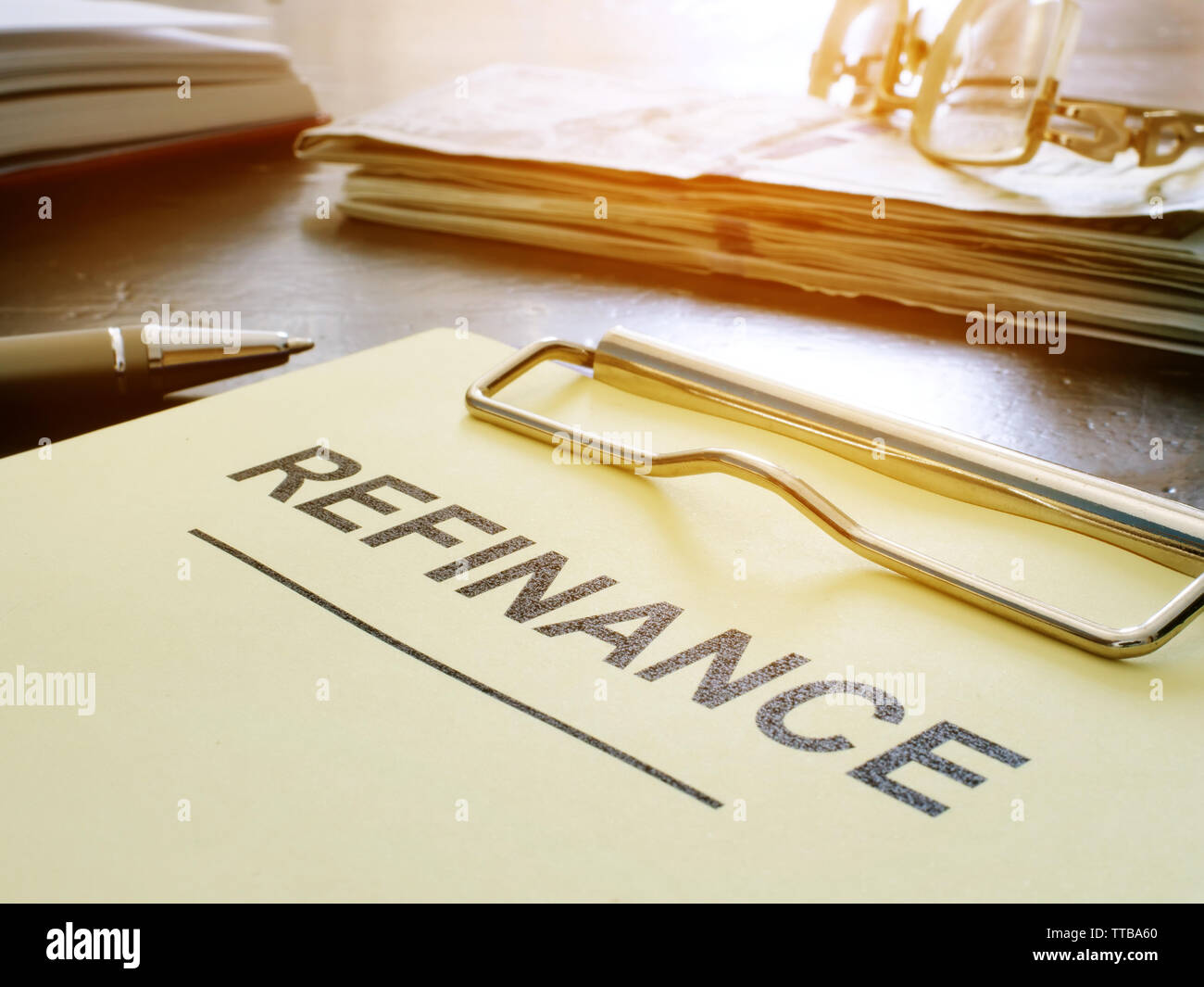 Refinance concept. Stack of business documents on table. Stock Photo