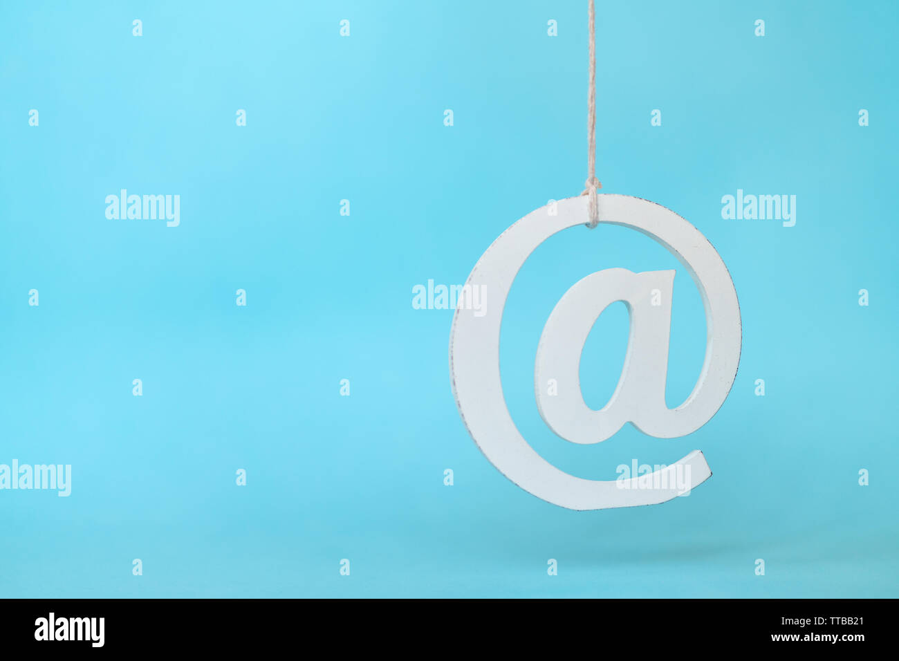 Hanging Email Icons Against Blue Background Stock Photo - Alamy