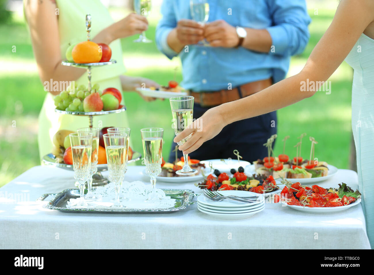 Guests drink champagne on wedding ceremony Stock Photo Alamy