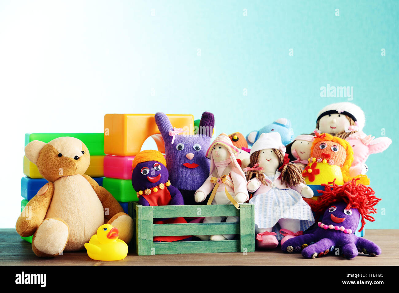Pile of toys on blue background Stock Photo - Alamy
