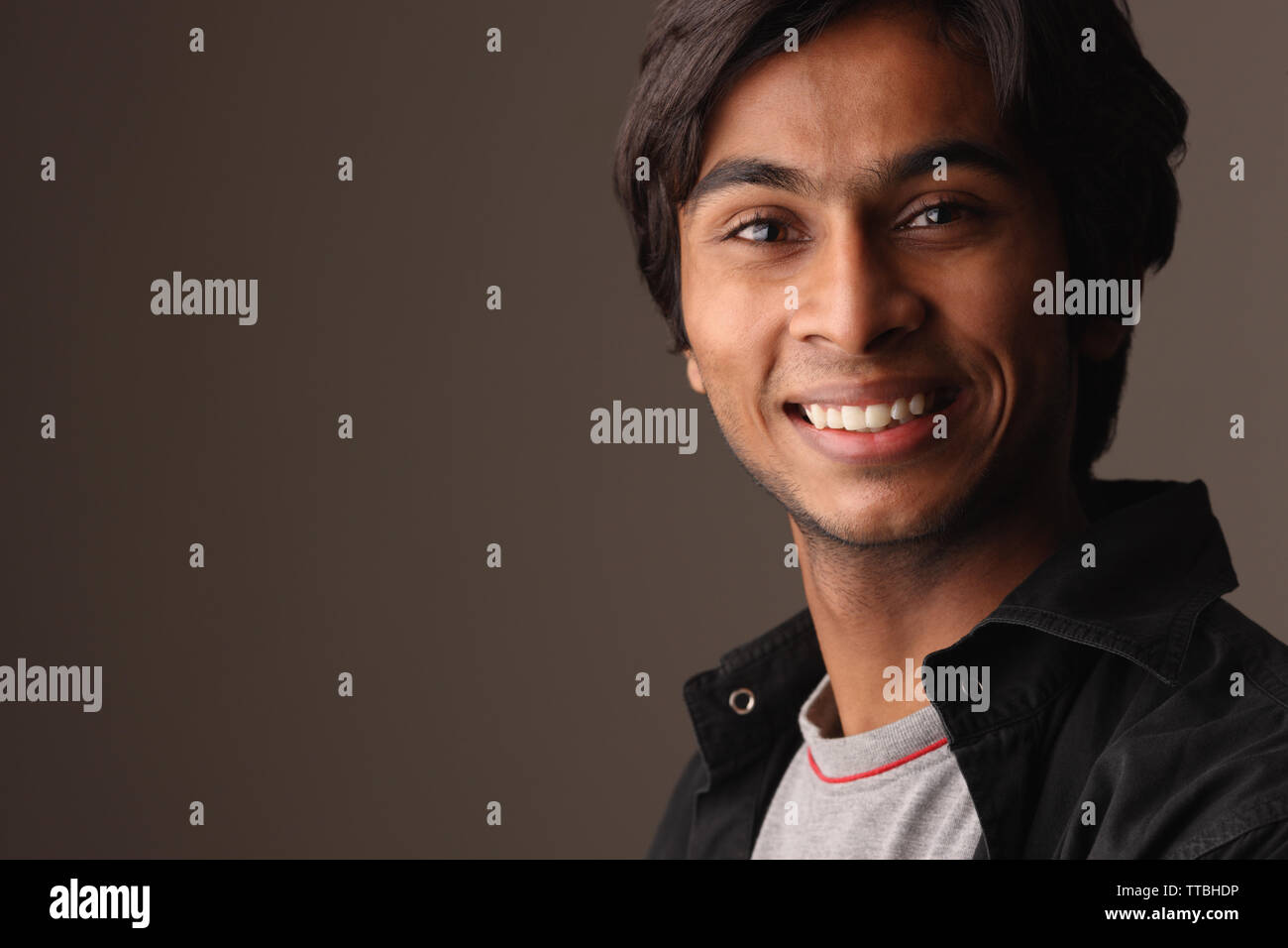 Portrait of a teenage boy smiling Stock Photo - Alamy