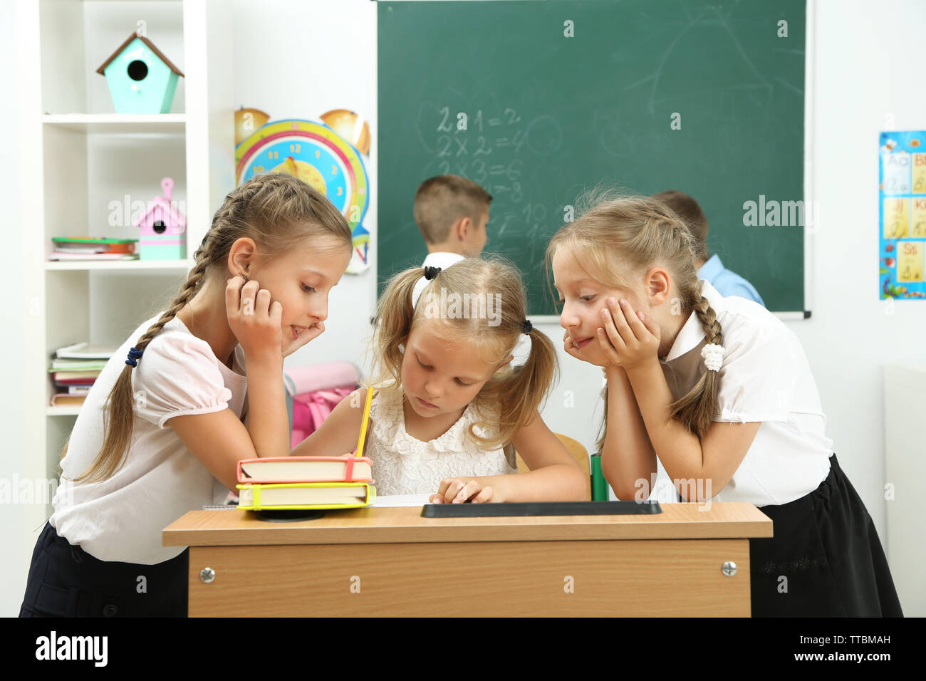 Portrait of happy schoolgirls at lesson Stock Photo - Alamy