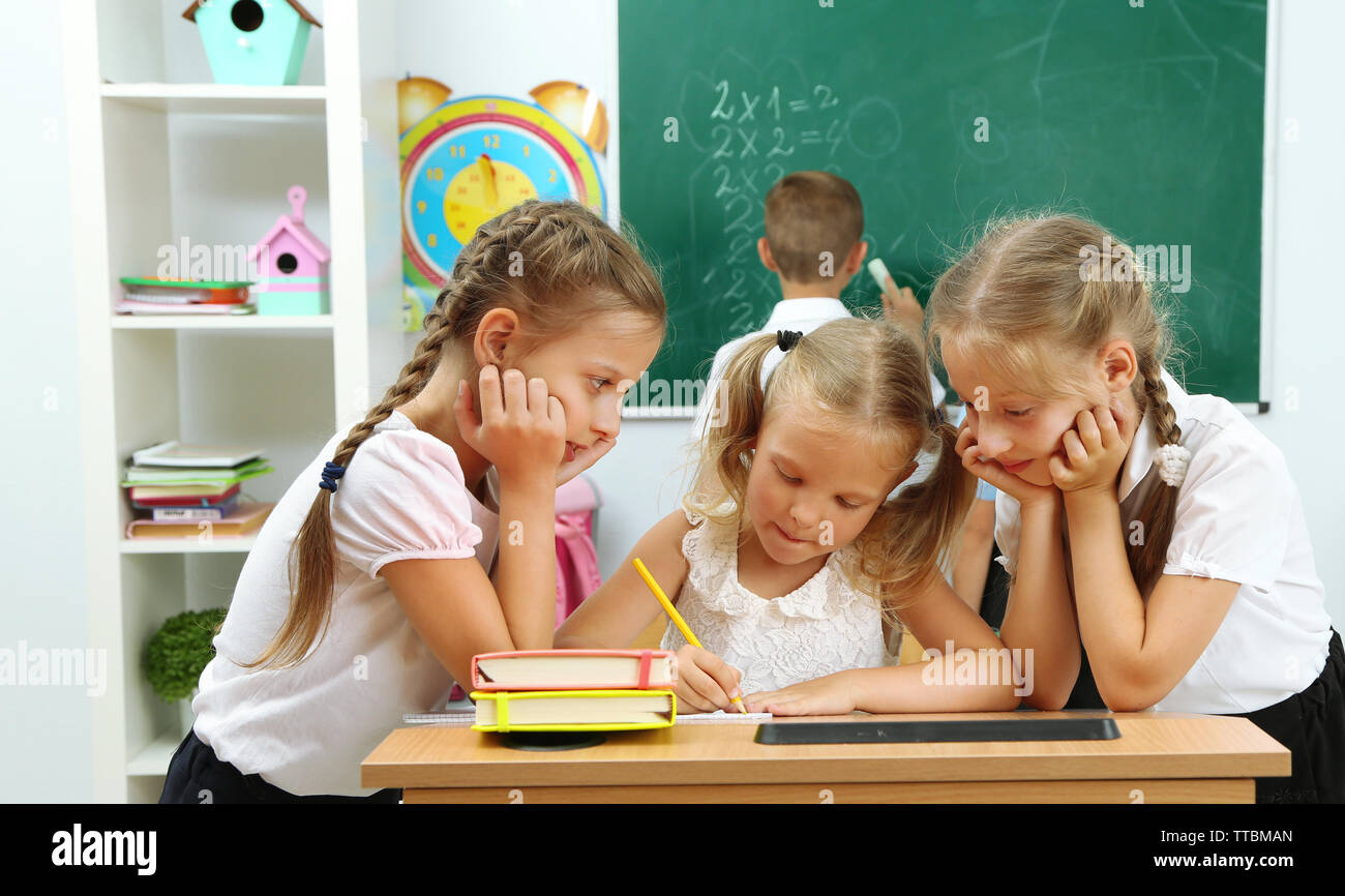 Portrait of happy schoolgirls at lesson Stock Photo - Alamy