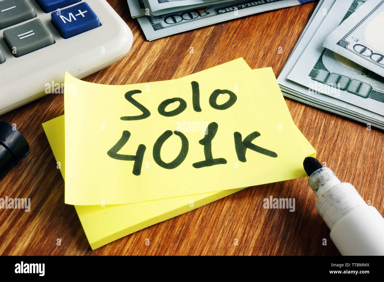 Solo 401k concept. Piece of paper and calculator. Stock Photo