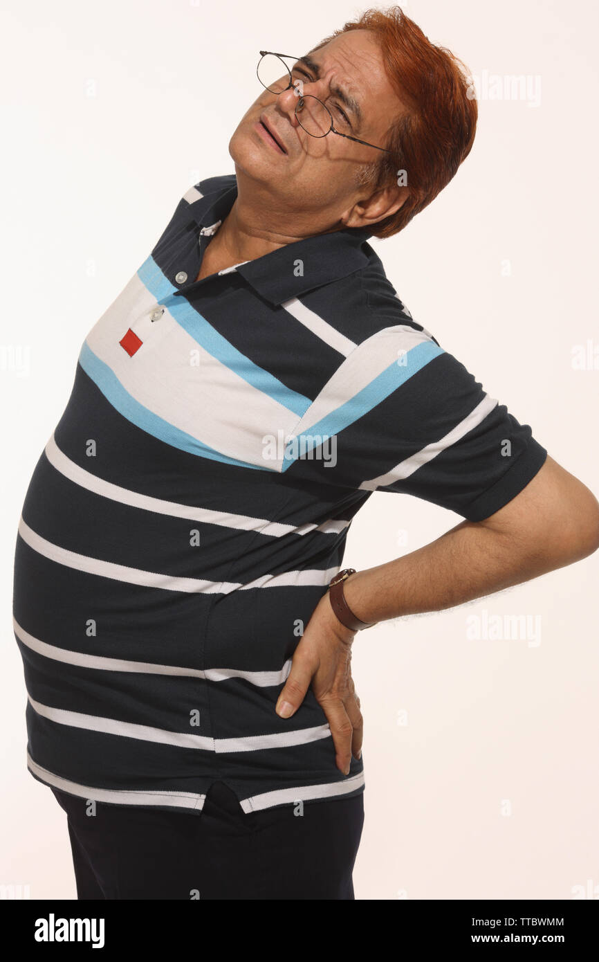Man suffering from back pain Stock Photo - Alamy