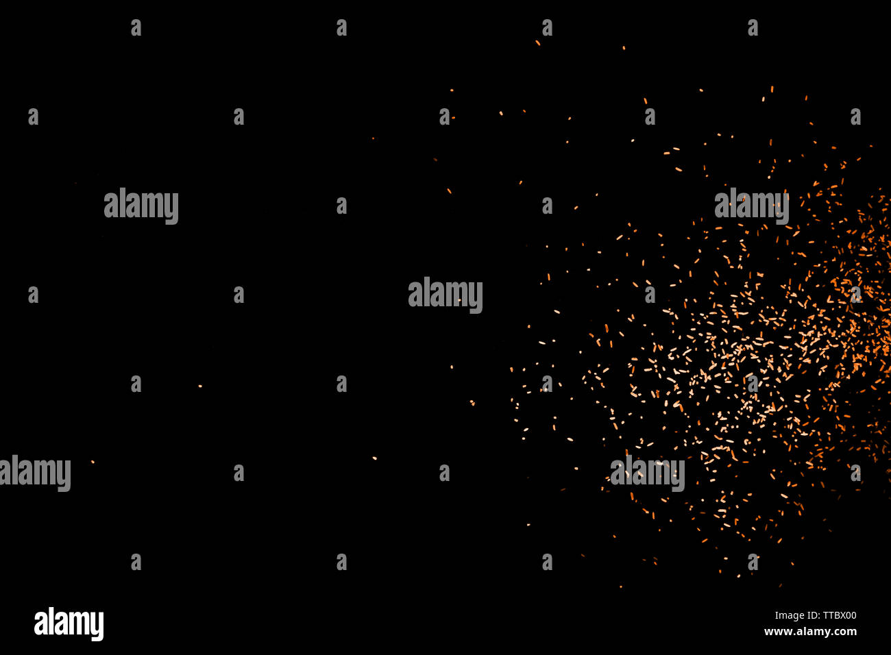 Random flying red orange color particles isolated on the black ...