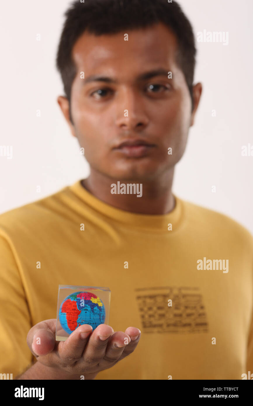 Man showing a paperweight Stock Photo