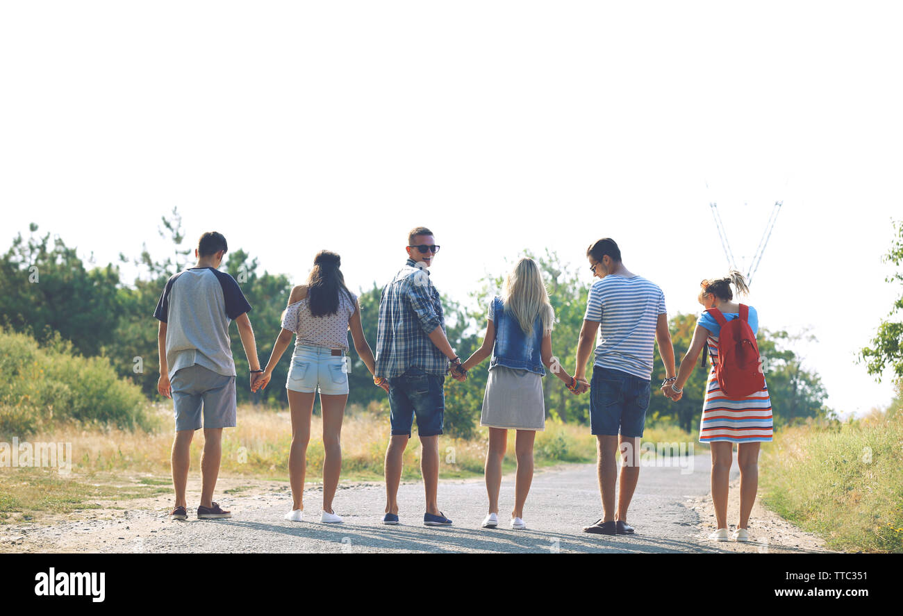 Happy friends jumping together, outdoors Stock Photo - Alamy