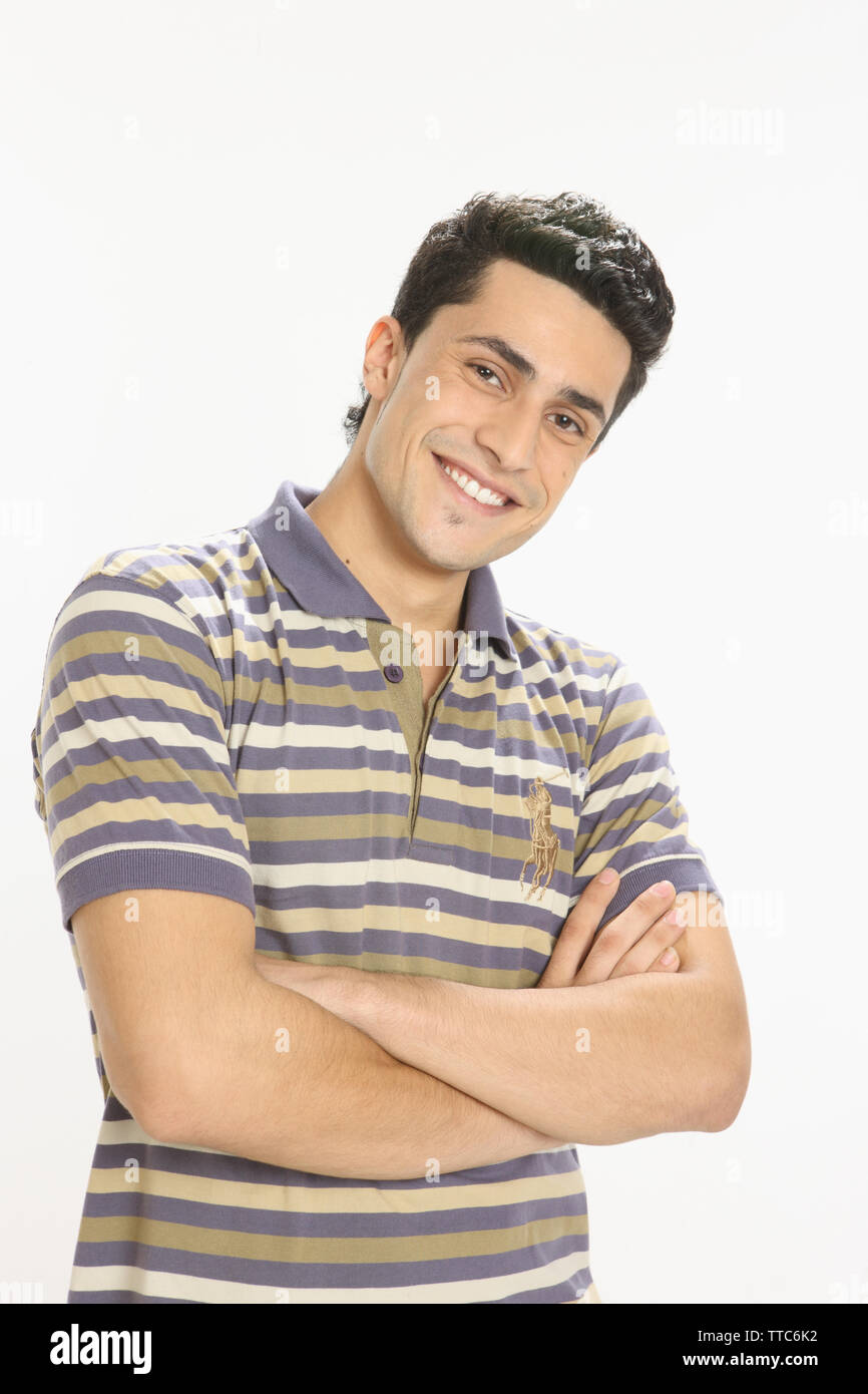 Portrait of a man smiling with arms crossed Stock Photo - Alamy