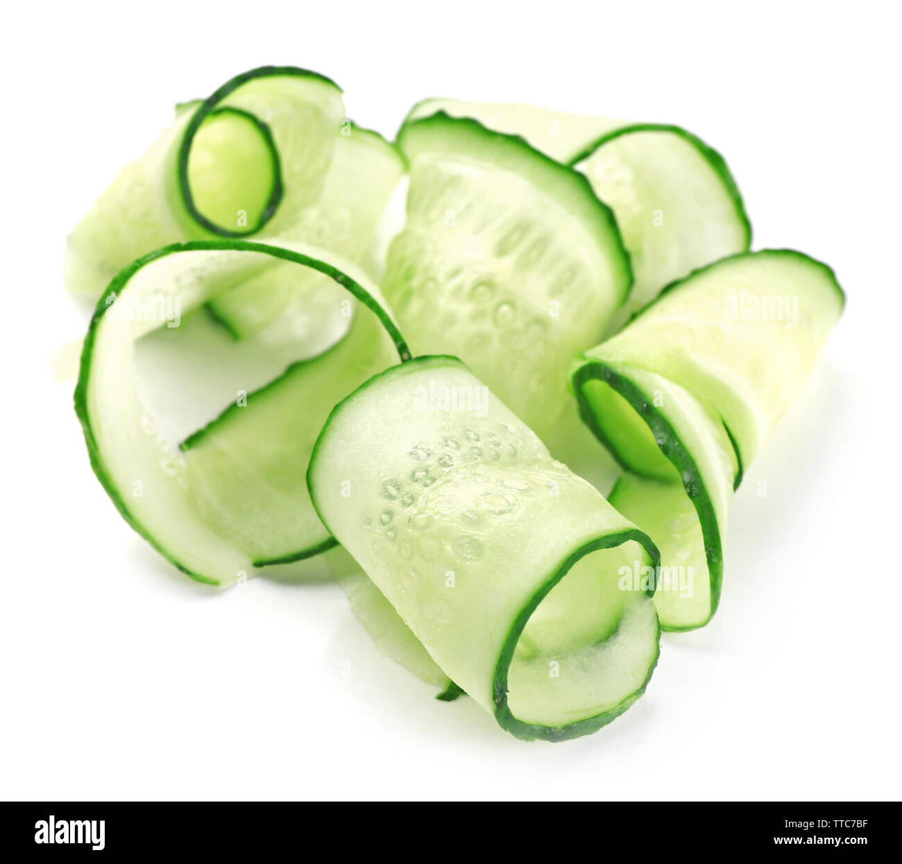 Sliced cucumbers isolated on white Stock Photo