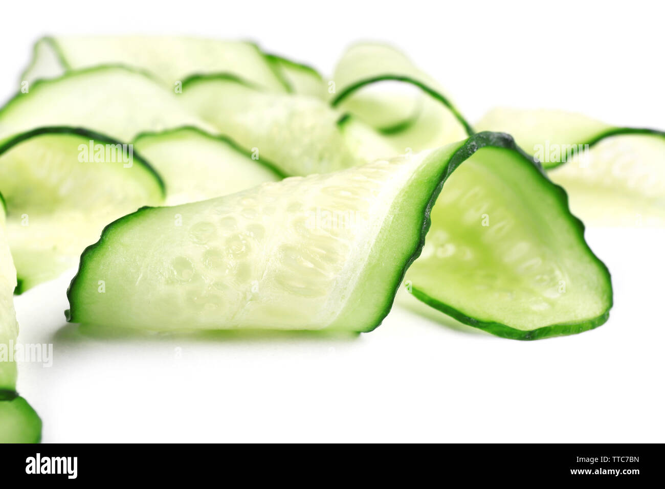Sliced cucumbers isolated on white Stock Photo