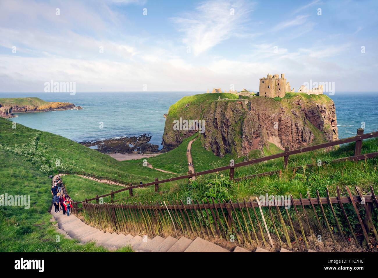 Eye level view of Dunnottar Castle, Stonehaven, Aberdeenshire, Scotland,  UK. with visitors climbing steps in the foreground after their visit Stock  Photo - Alamy