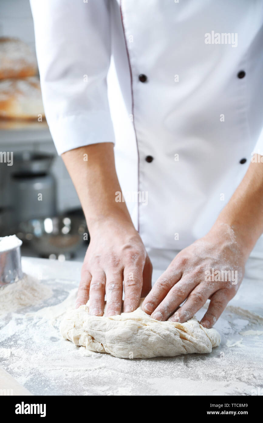 Making dough by male hands at bakery Stock Photo - Alamy
