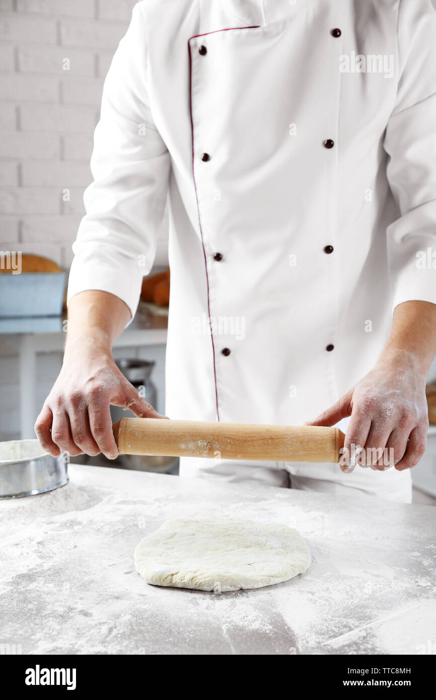 Making dough by male hands at bakery Stock Photo - Alamy