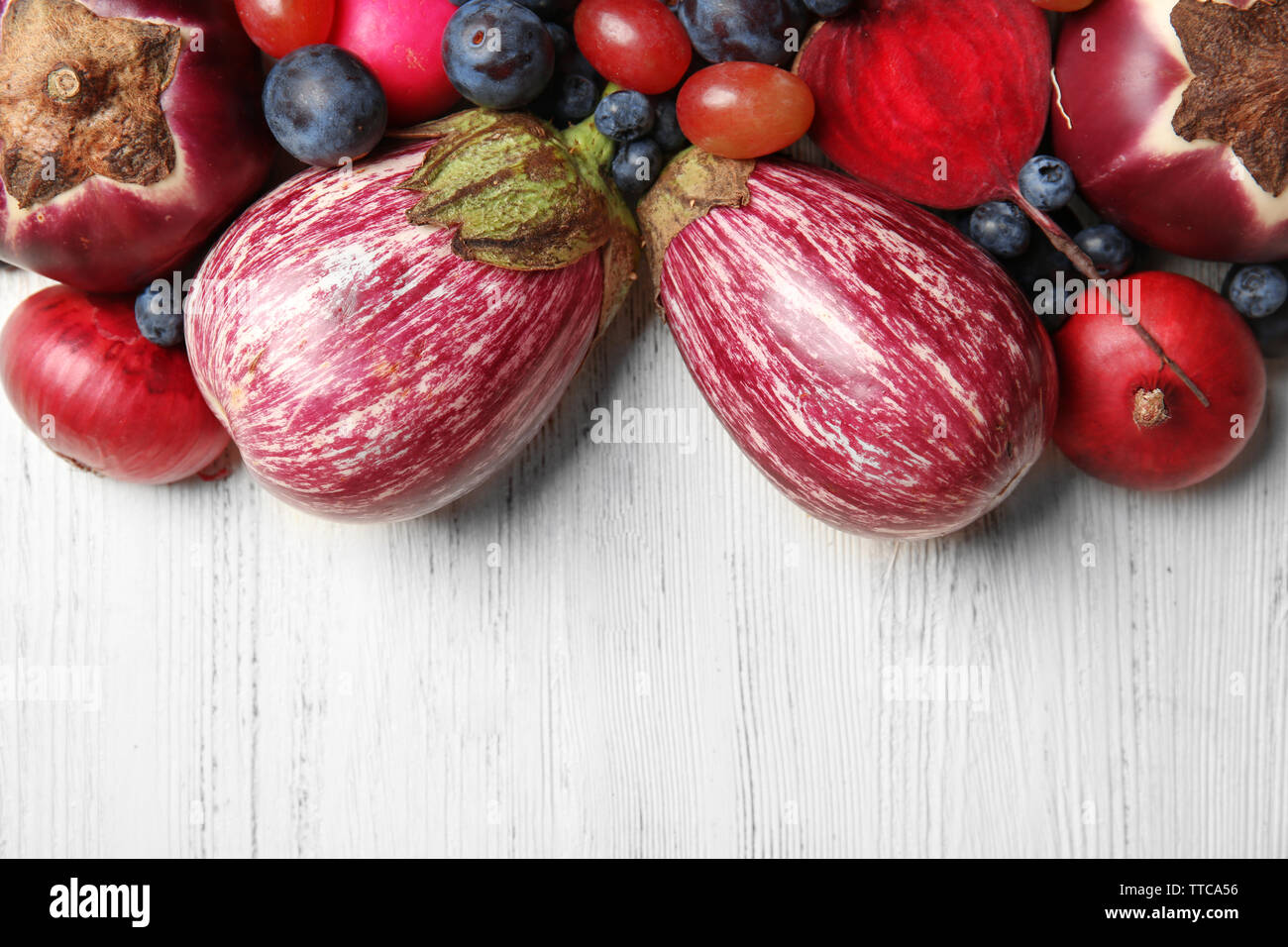 Fruits and vegetables on wooden table Stock Photo - Alamy