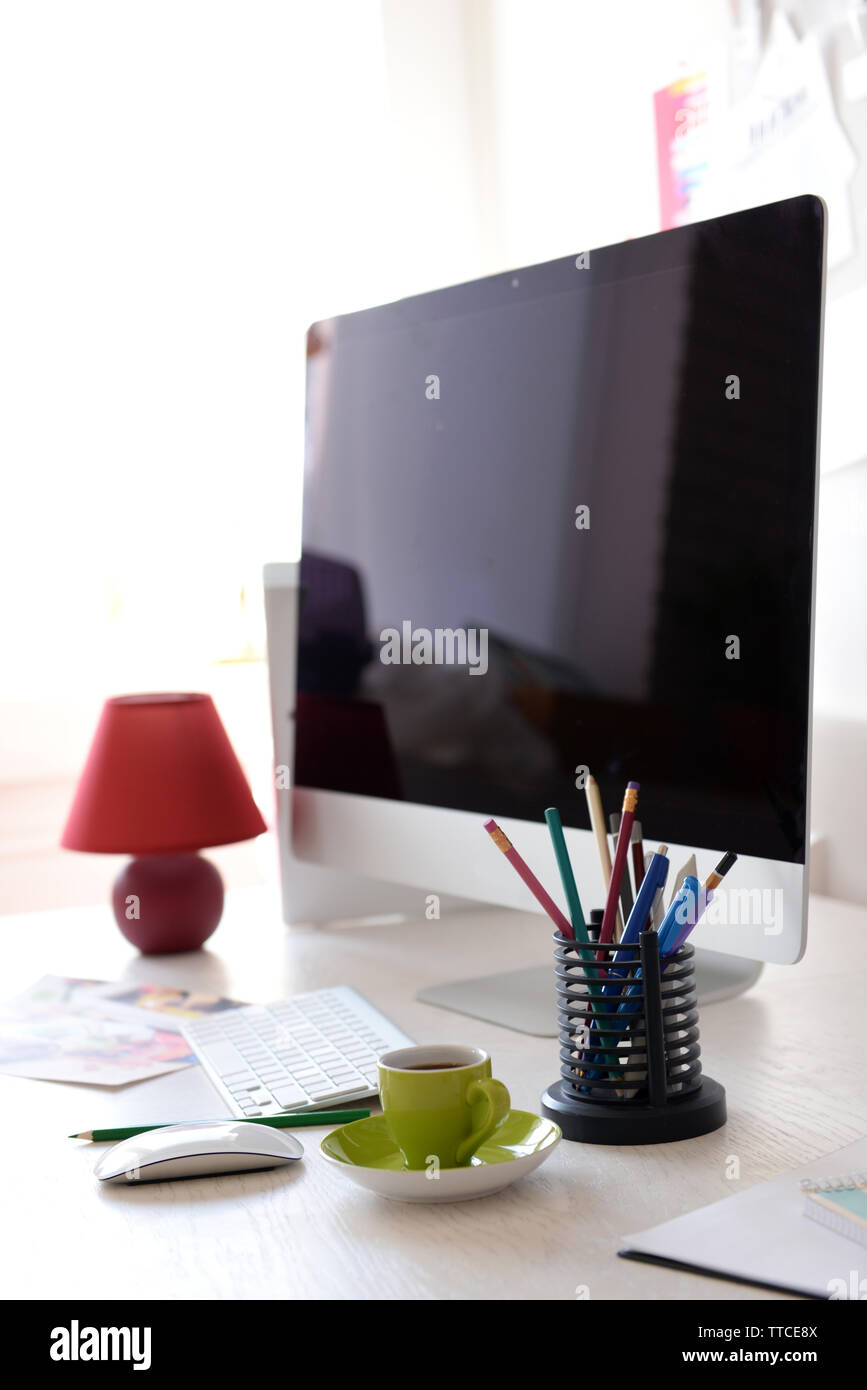Modern computer on the table in decorated room Stock Photo Alamy