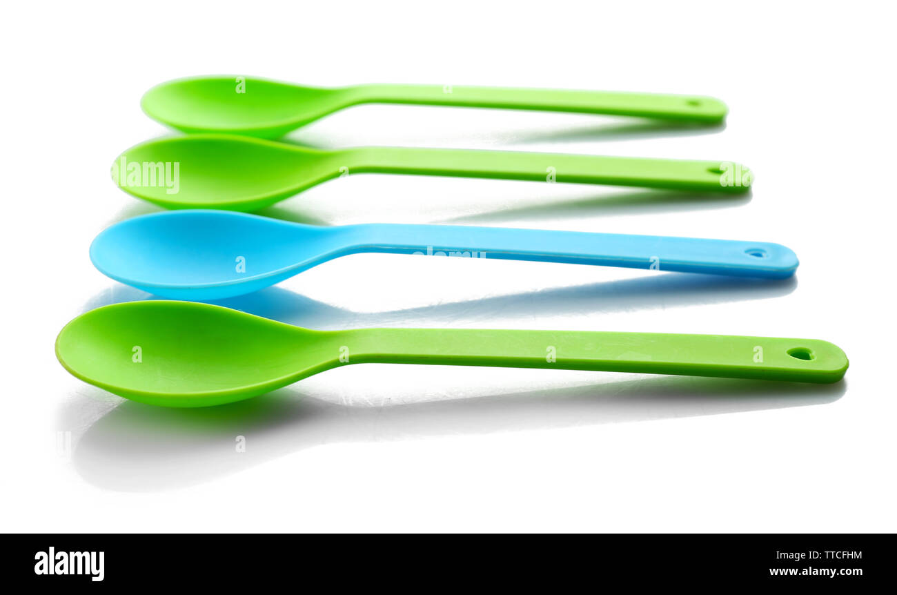 Disposable colourful spoons, isolated on white, Individuality concept