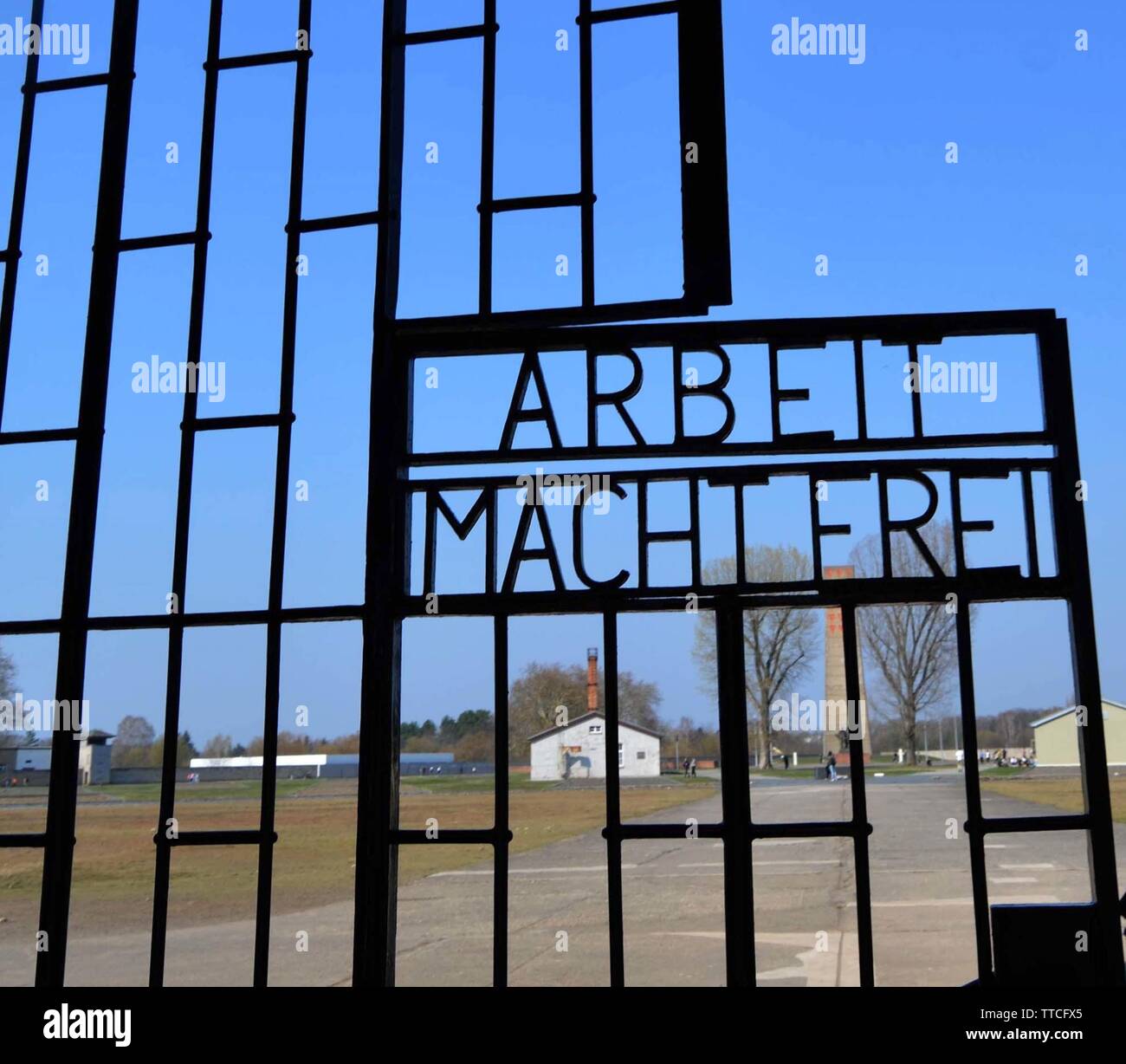 The Arbeit Macht Frei iron gate at the entrance to Sachsenhausen Concentration Camp, Oranienburg, Germany Stock Photo