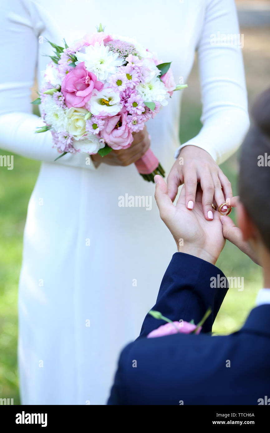Groom wears wedding ring hi-res stock photography and images - Alamy