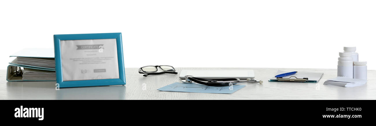 Doctor table with tools on white background Stock Photo - Alamy