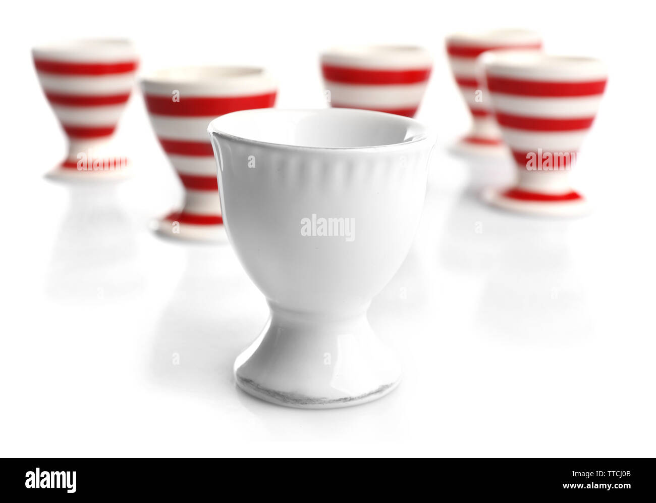 Red and White stripe egg cups, isolated on white Stock Photo