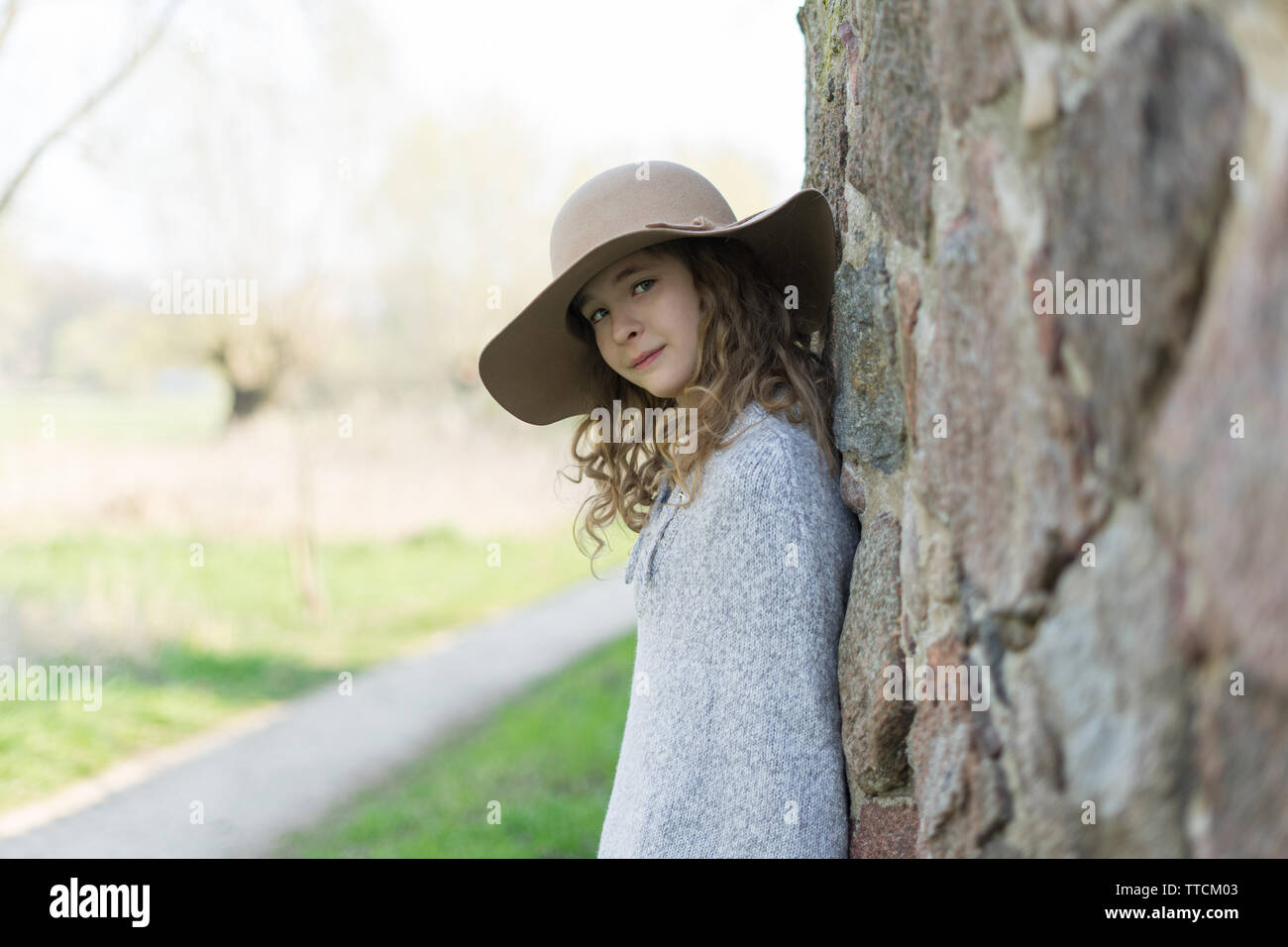 Portrait of a beautiful young girl in a hat Stock Photo - Alamy