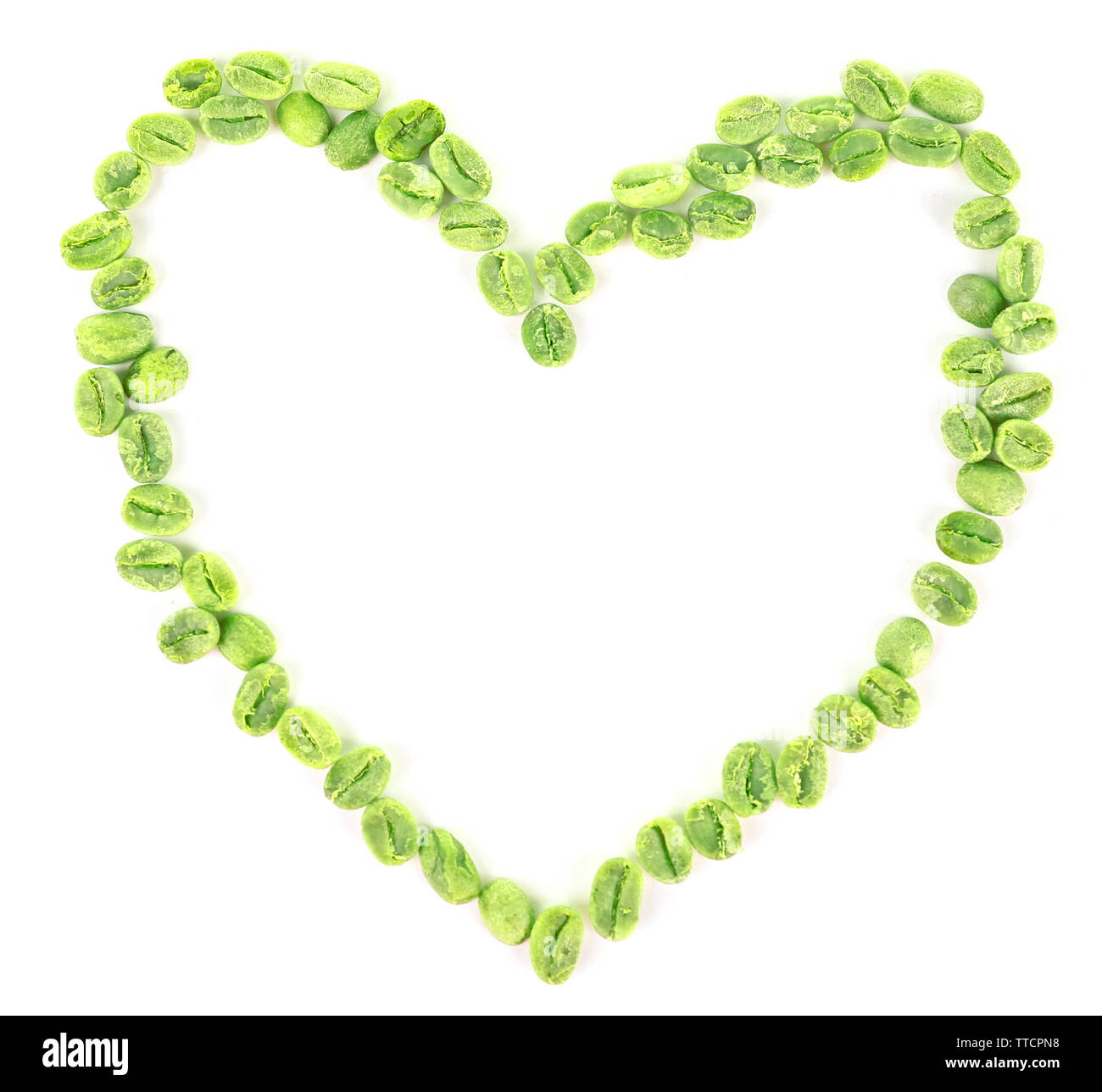Heart shaped peanuts isolated on white Stock Photo