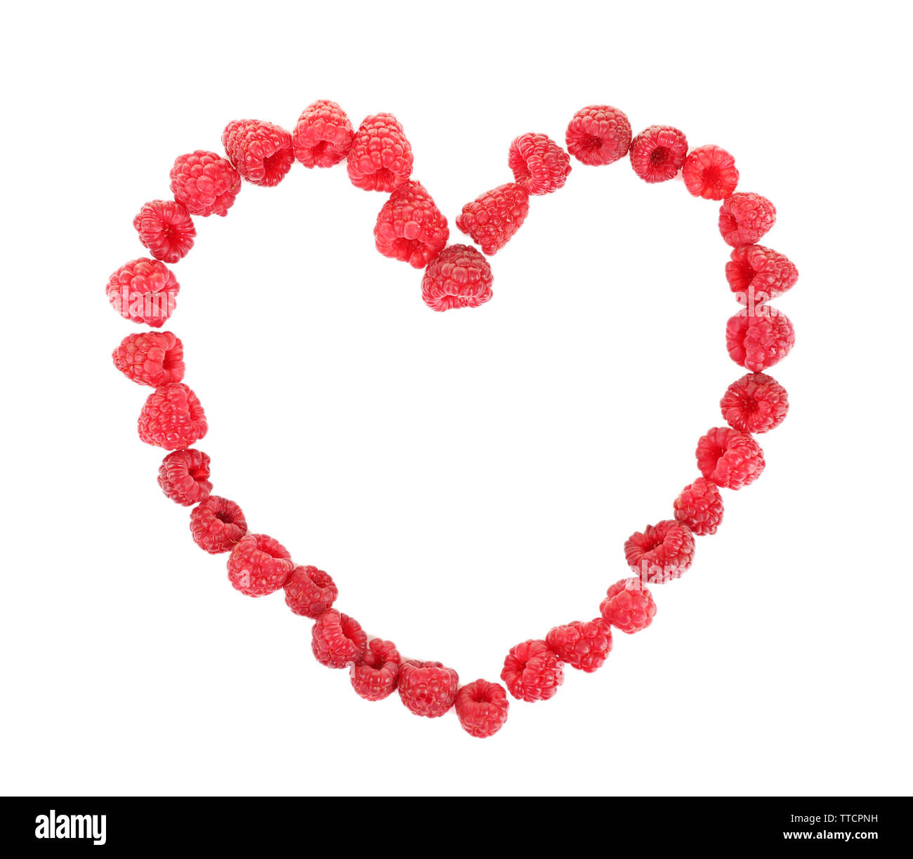 Heart shaped raspberries isolated on white Stock Photo - Alamy