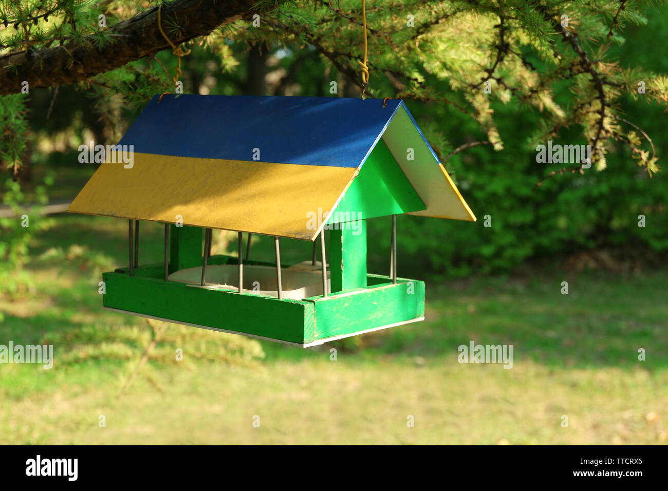 Bird feeder house with bird food, outdoor Stock Photo Alamy