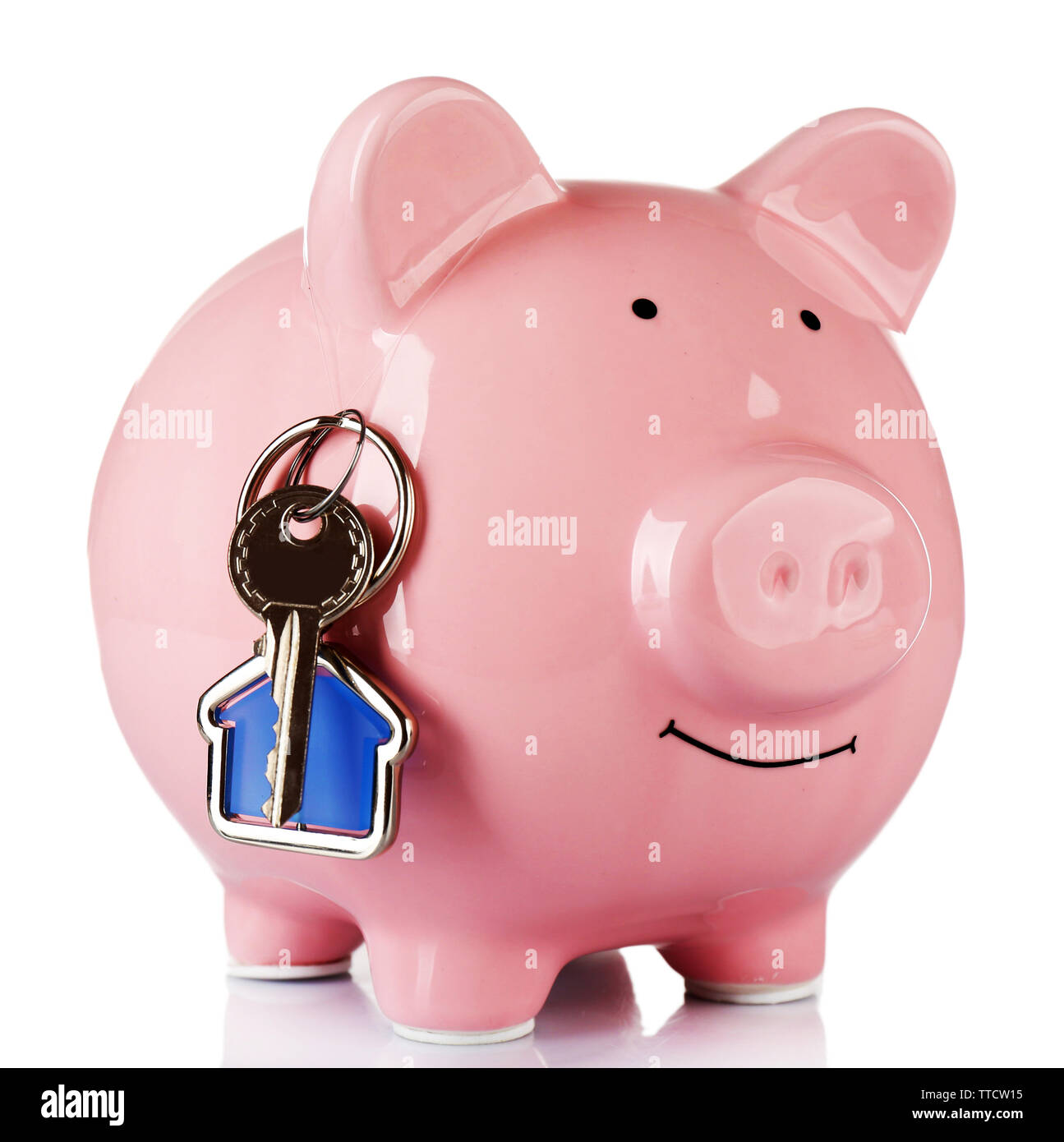 Piggy bank style money box with key isolated on a white Stock Photo - Alamy