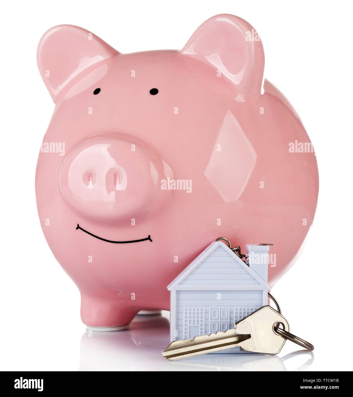 Piggy bank style money box with key isolated on a white Stock Photo - Alamy