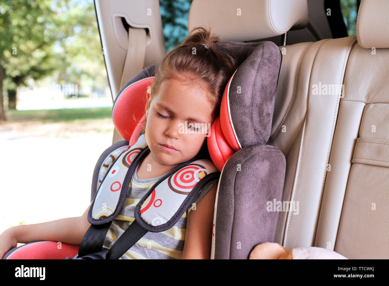Adorable little girl sleeping in the car Stock Photo Alamy
