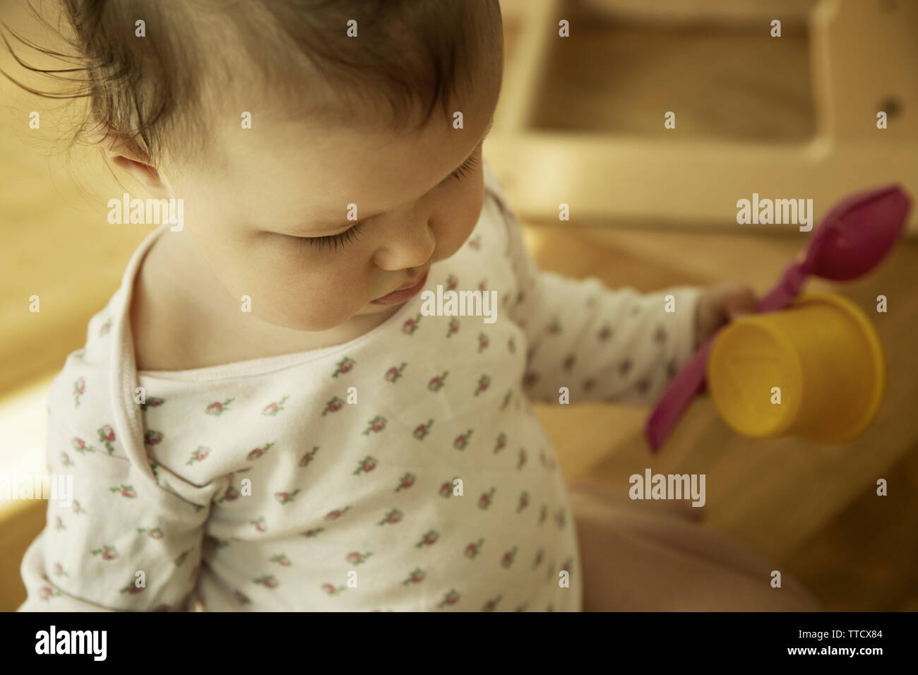 Cute little baby girl with toys Stock Photo
