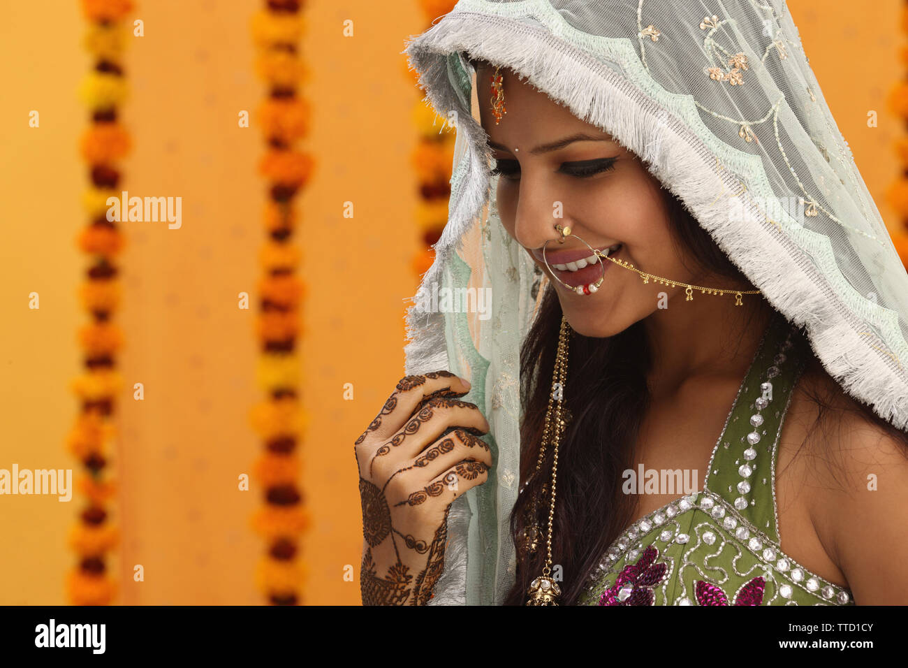Indian bride wearing a stole smiling Stock Photo