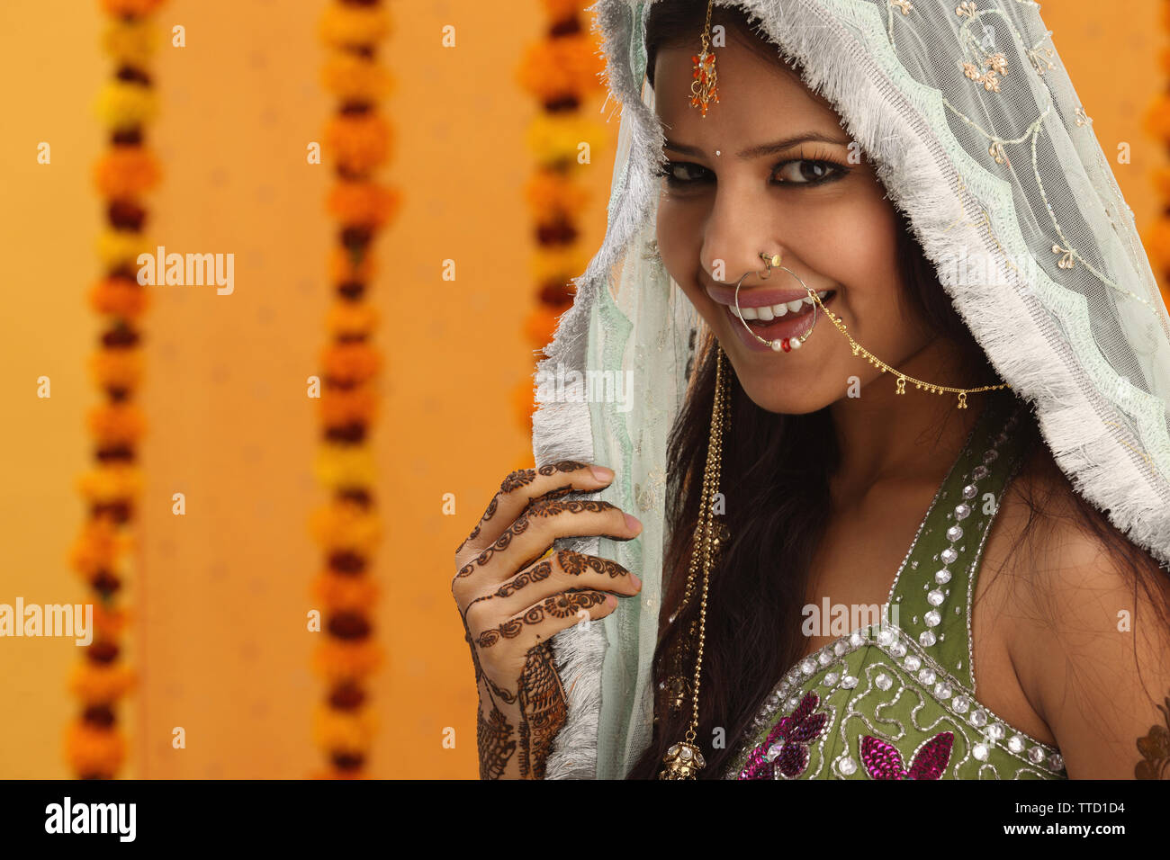 Indian bride wearing a stole smiling Stock Photo - Alamy