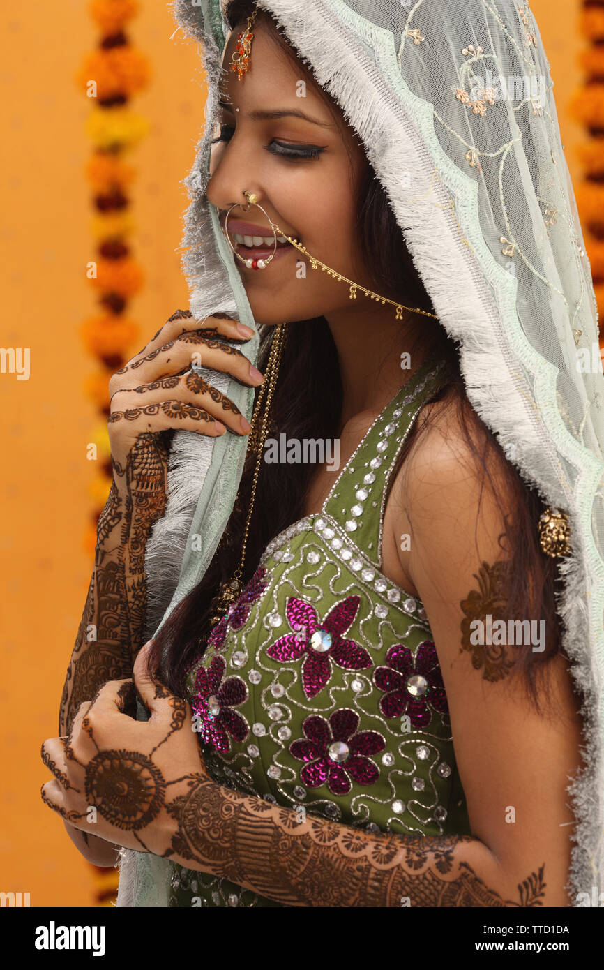 Indian bride wearing a stole smiling Stock Photo