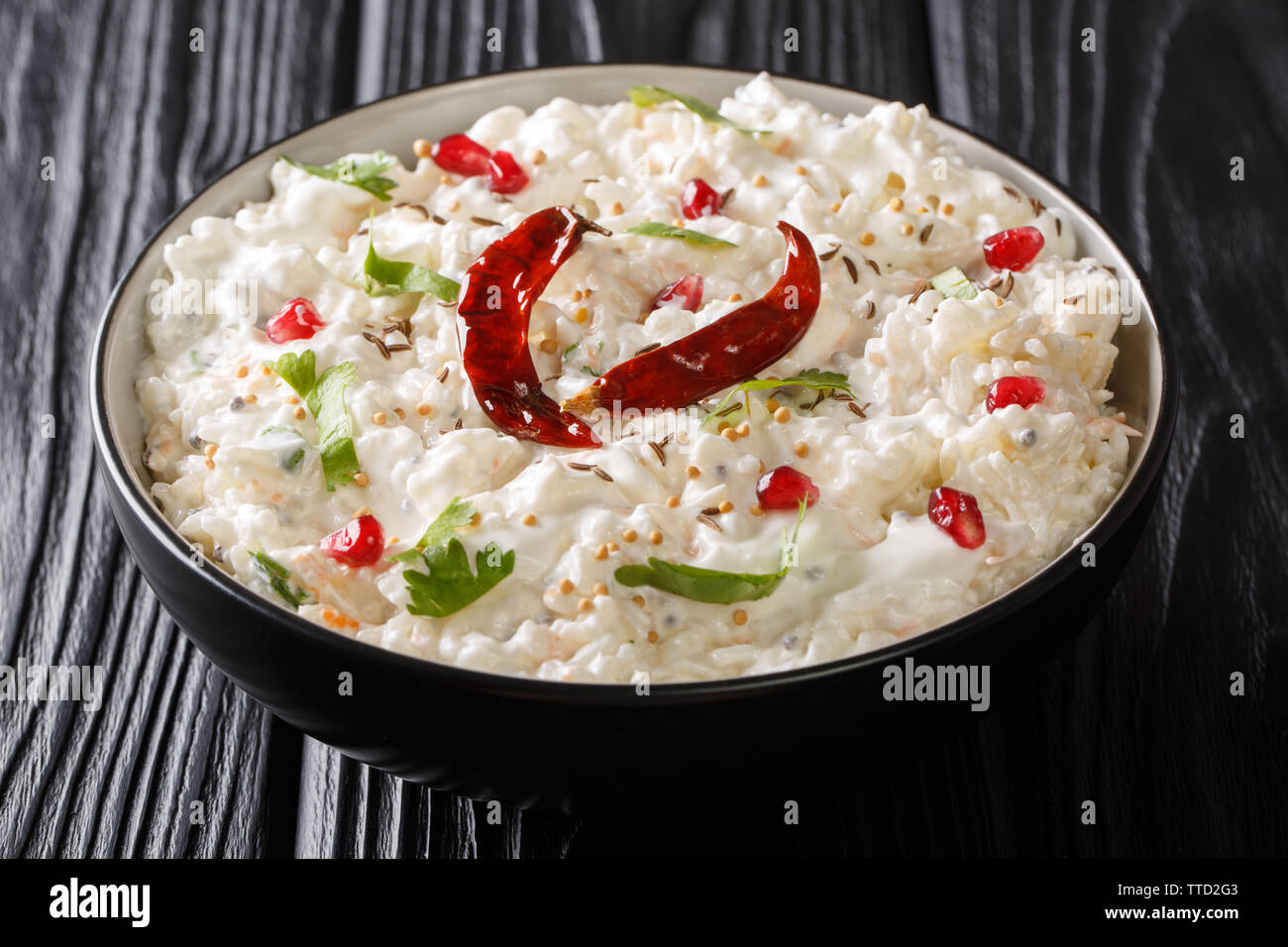 Curd rice from South India is creamy rice mixed with yogurt and spices close-up in a bowl on the table. horizontal Stock Photo