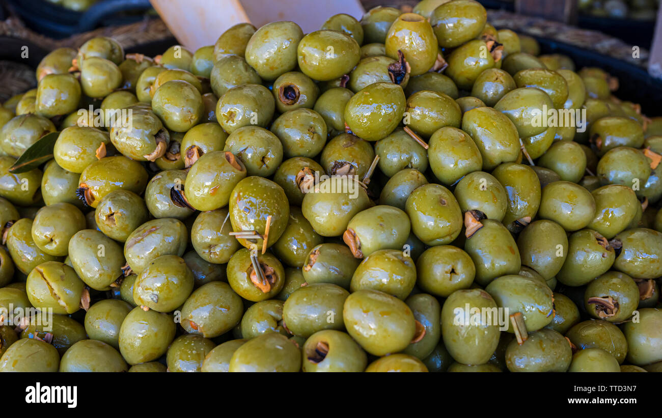 Olives stuffed with anchovy, typical Spanish food, pickles in vinegar
